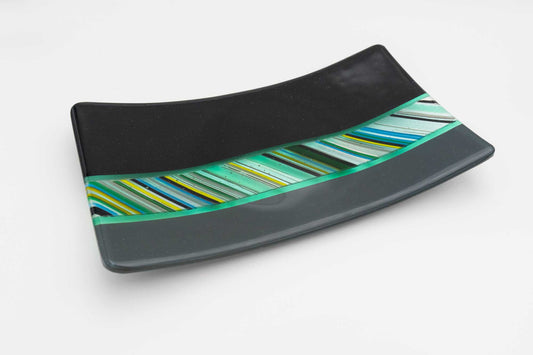 Art Glass Platter divided into three sections: black, grey and green-blue-yellow stripes.